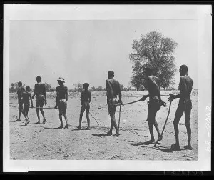 Children leading adults with river blindness Children leading adults with river blindness